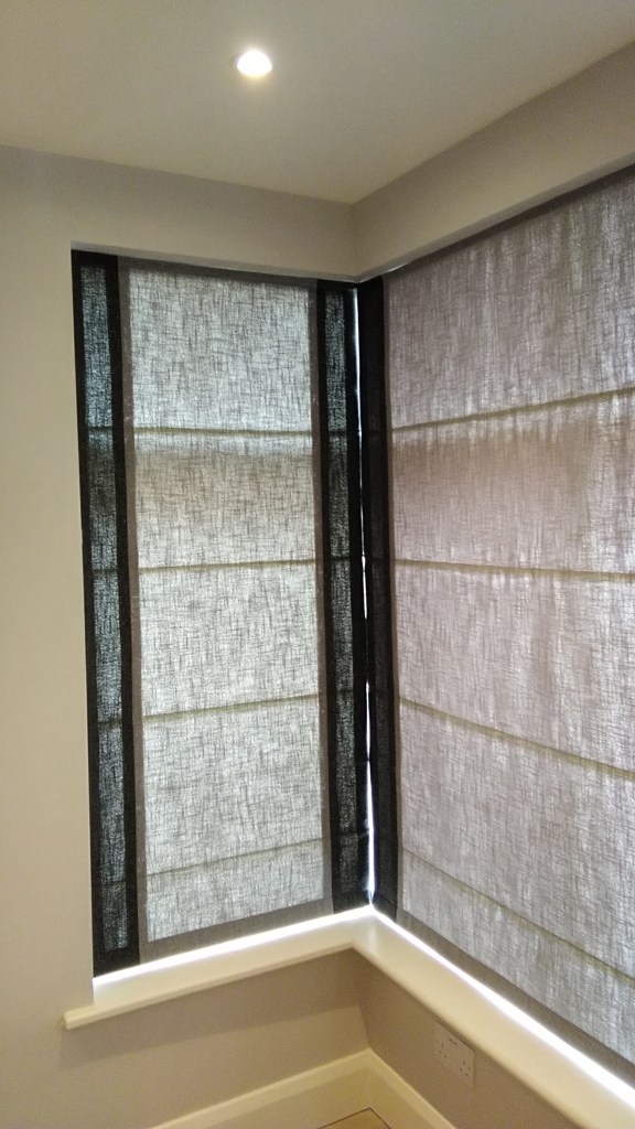 Roman blinds on a corner window