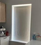Roller blinds in a kitchen fully rolled down