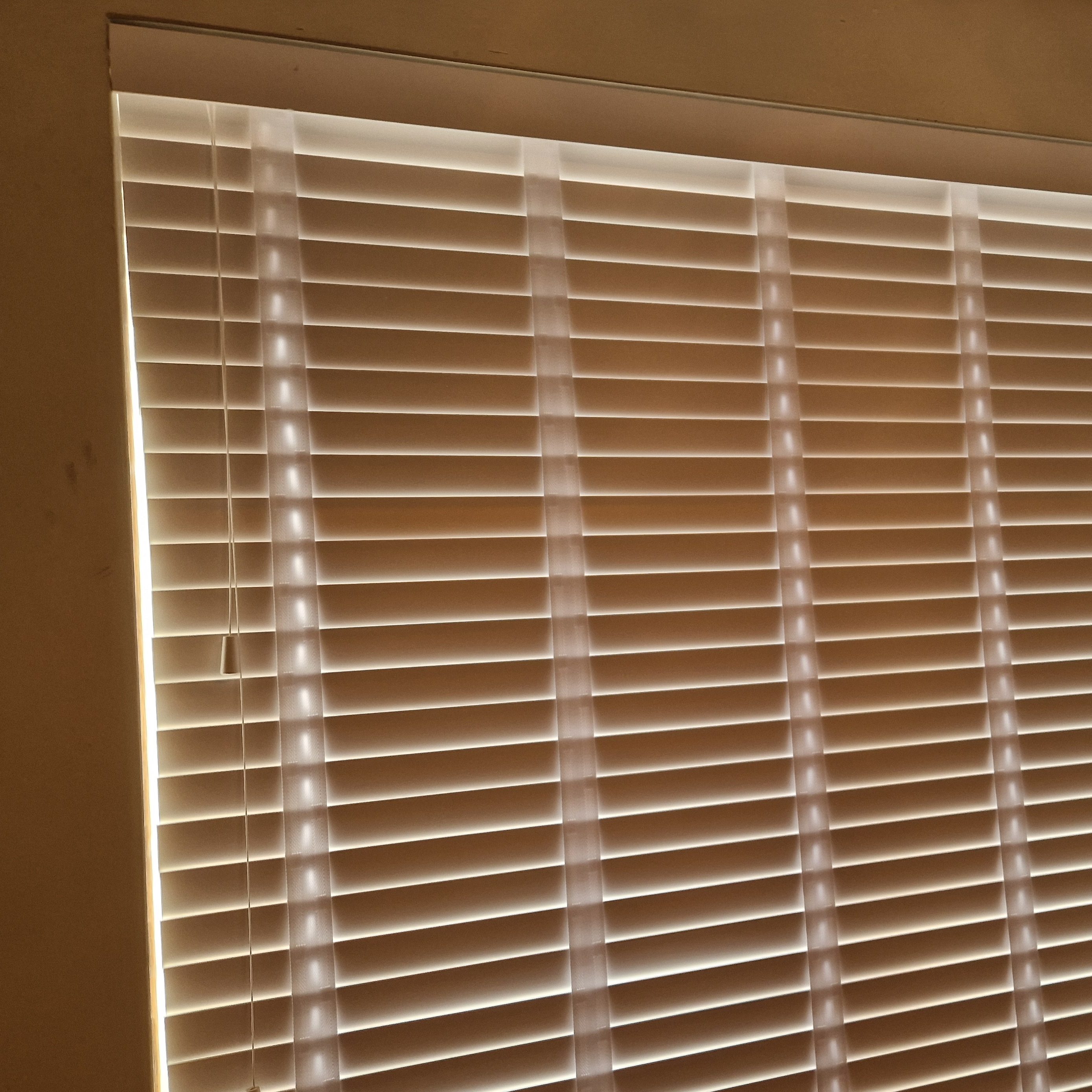 Wooden Blinds closed on a window from the inside